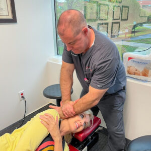 Dr. Packer NUCCA adjustment Dr. David Packer performing a NUCCA chiropractor correction on a patient at Precision Spinal Care