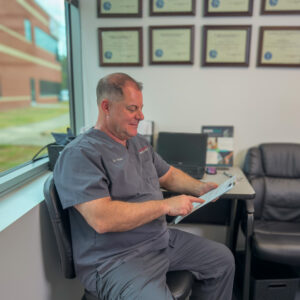 IMG_0743-3 Dr. Packer holding a clipboard during an exam