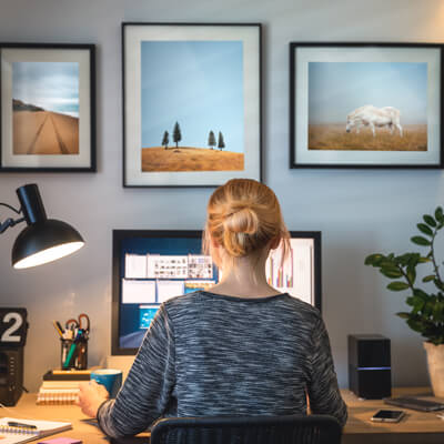 Woman working at a desk with poor posture