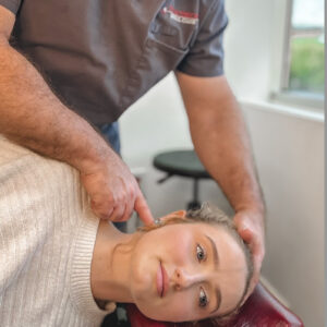 Screenshot Dr. Packer performing a NUCCA upper cervical spinal assessment